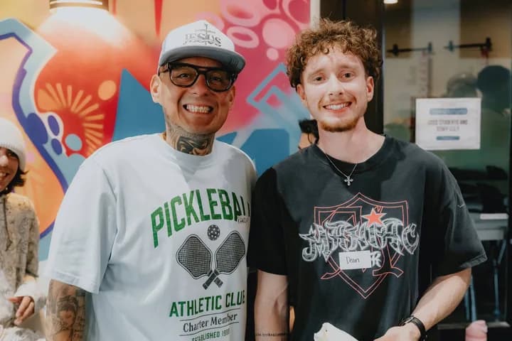 Two men smiling at a Sacramento Tabernacle gathering